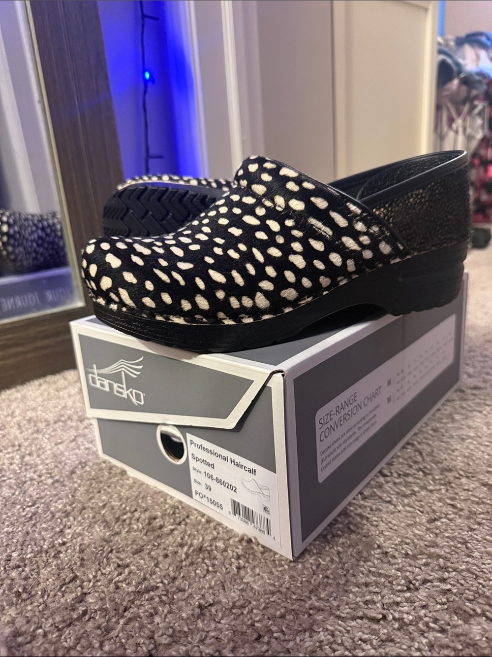 Dansko Black & White Spotted Haircalf Clog